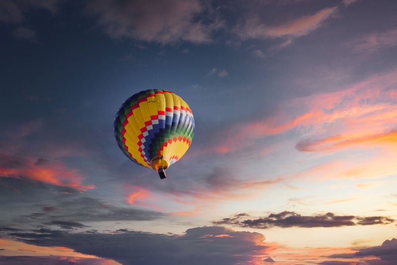 Hot air balloon over scenic landscape